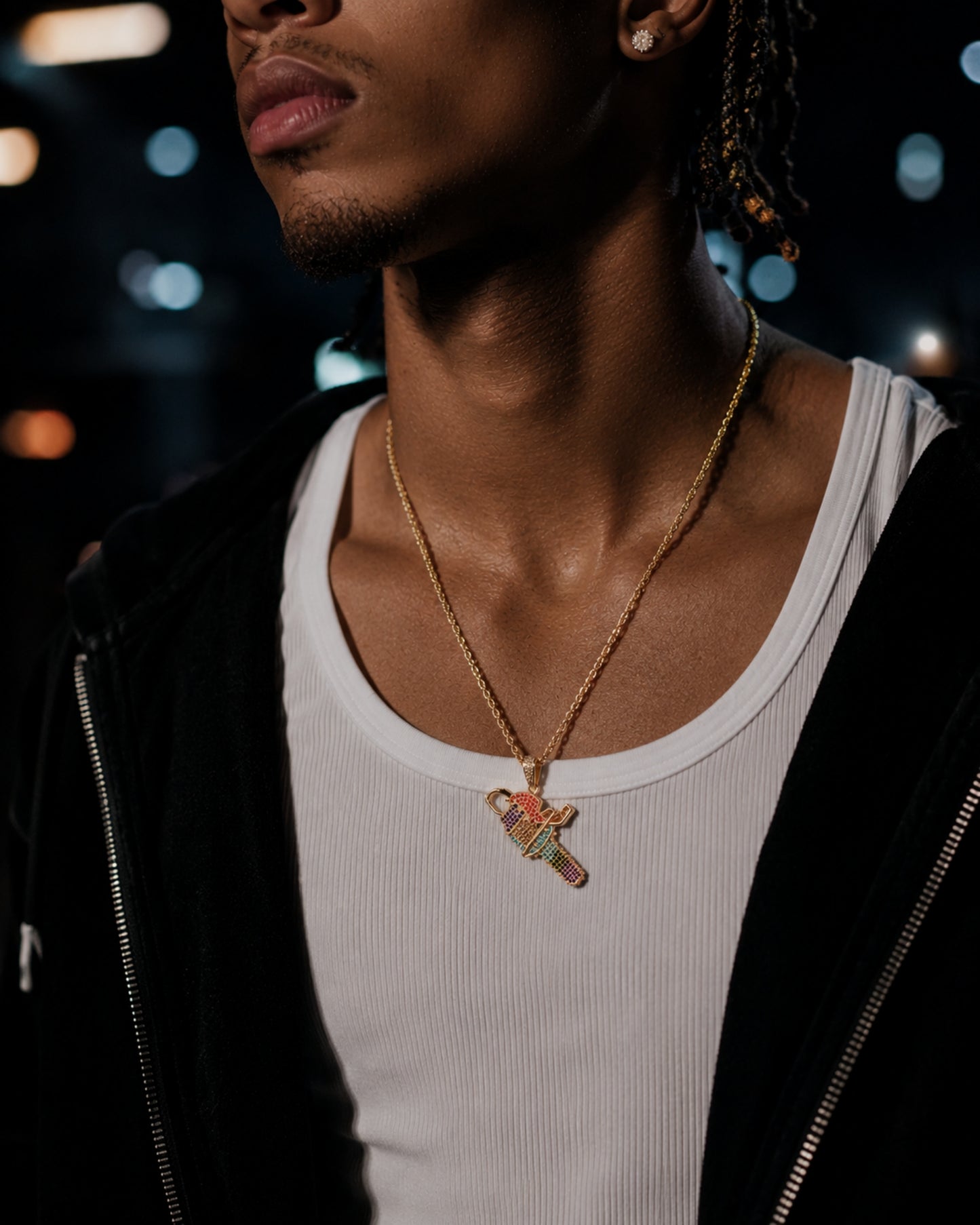 Male model wearing the ICEDIAMOND 18k gold plated iced out rainbow color chainsaw pendant necklace
