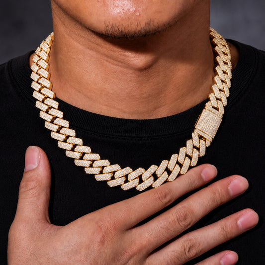 Male model wearing a 14k gold 20mm iced out Cuban link chain necklace
