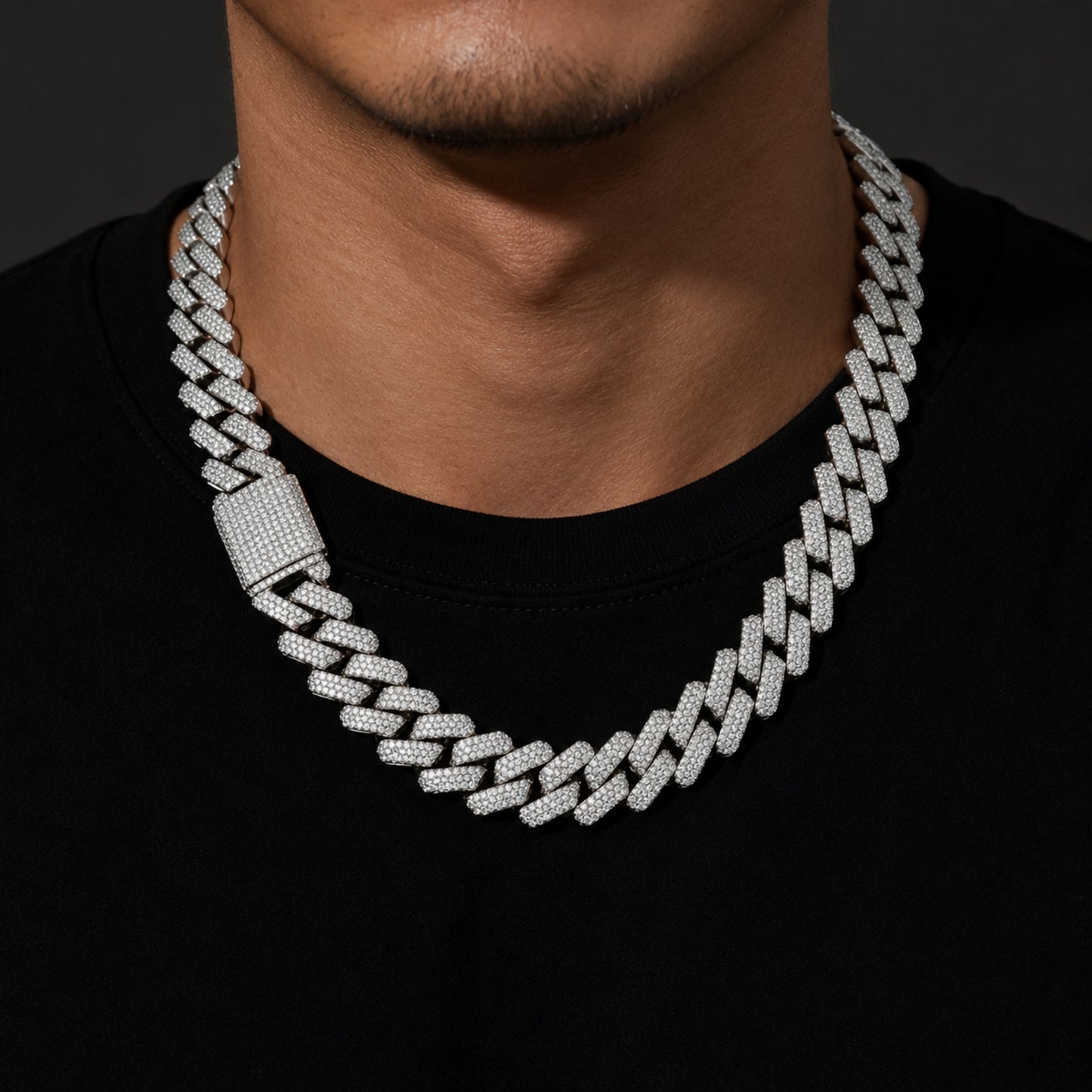 Male model wearing a white gold 20mm iced out Cuban link chain necklace
