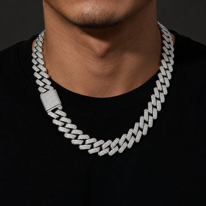 Male model wearing a white gold 20mm iced out Cuban link chain necklace
