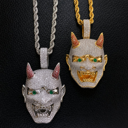 ICEDIAMOND LET LIGHT IN Oni mask pendant necklace with hand-set 5A cubic zirconia and 18K gold plated finish on a stainless steel rope chain.
