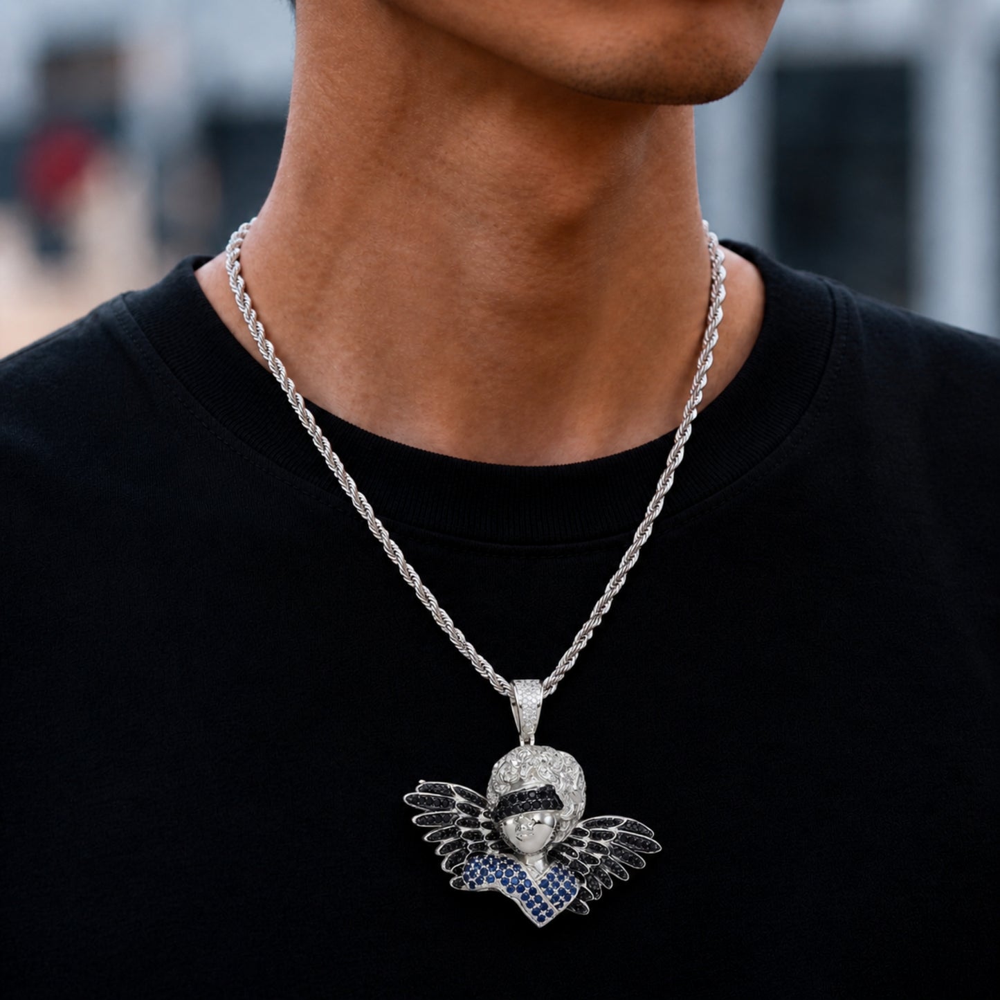 Male model wearing ICEDIAMOND TRUST BEYOND SIGHT angel pendant necklace
