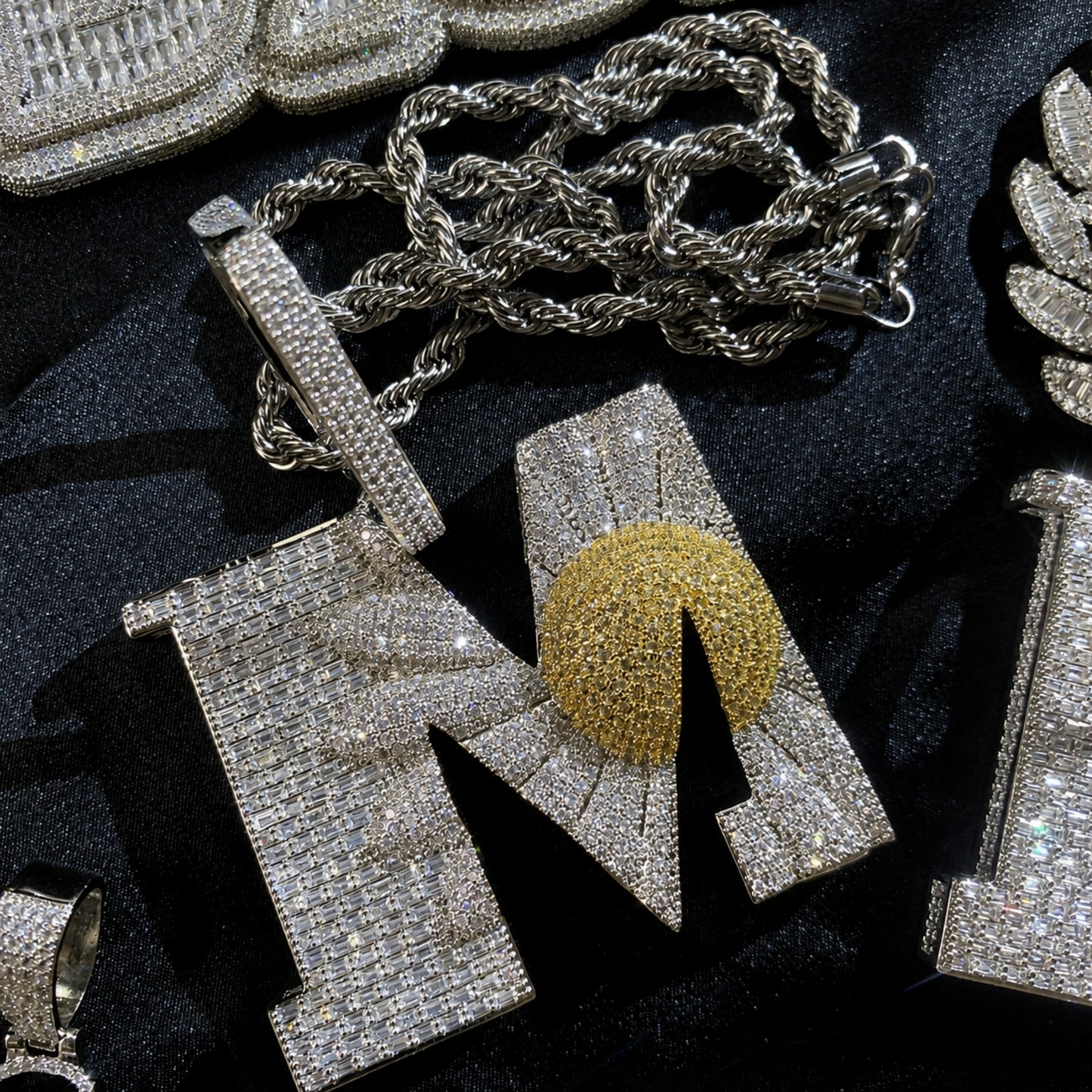 BEGIN AGAIN Letter M Sunrise pendant paired with stainless steel rope chain
