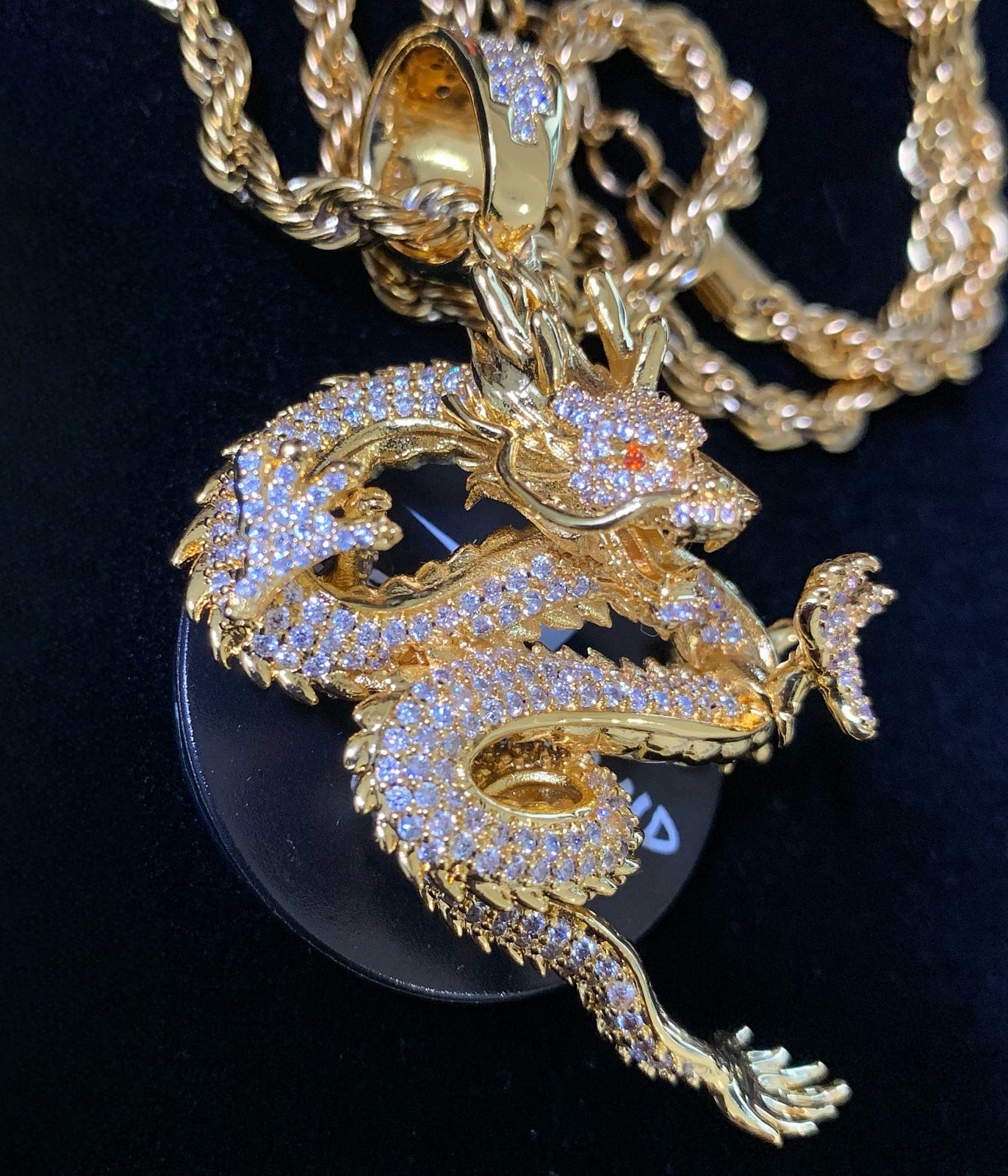 Side profile of the BORN TO RISE dragon pendant necklace
