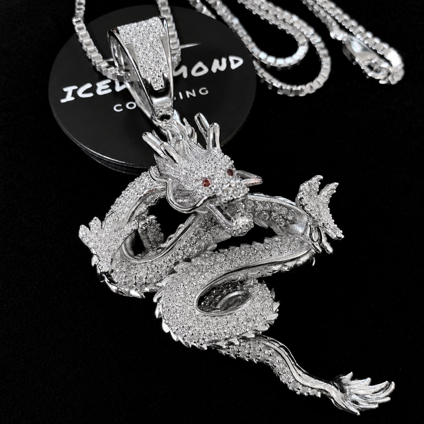 Close-up of the solid sterling silver dragon pendant with white gold plated and hand-set 5A cubic zirconia
