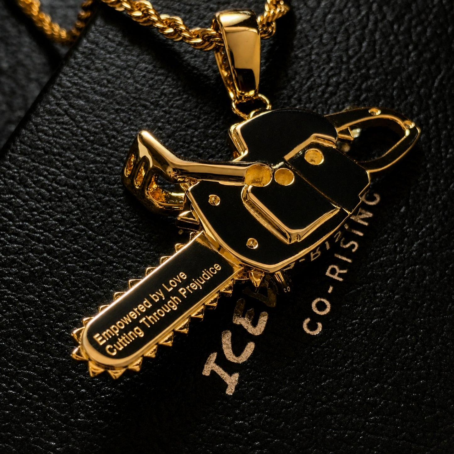 Rear engraving of the CUT THROUGH PREJUDICE chainsaw pendant
