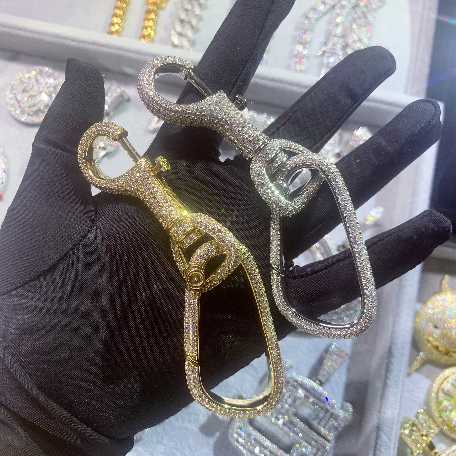 Luxury carabiner key clips available in 18K gold plated and white gold finishes
