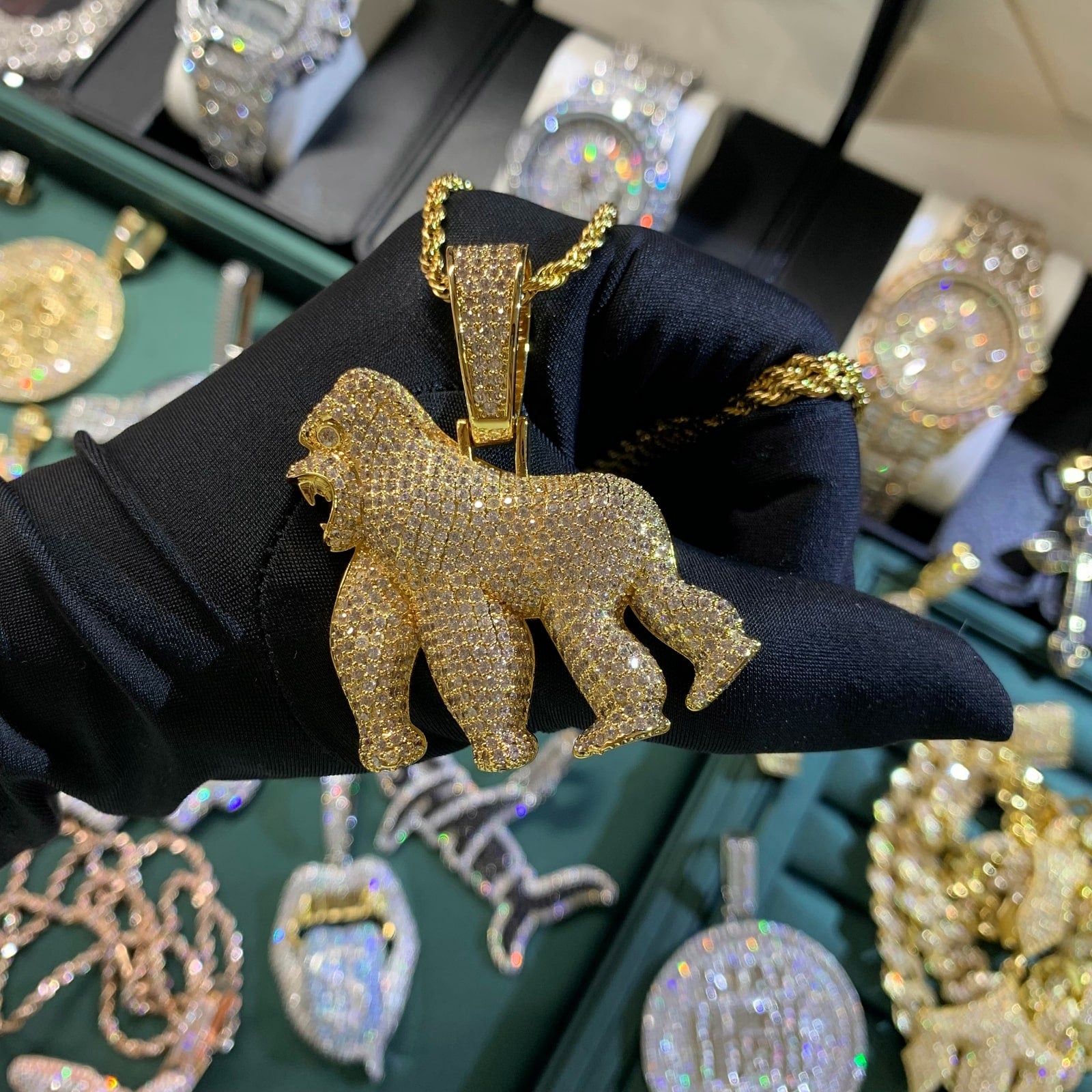 Close-up detail of the HOLD YOUR GROUND gorilla pendant with hand-set cubic zirconia
