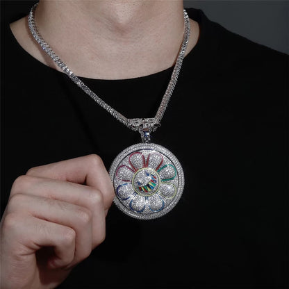 Rotating round floral pendant necklace styled as a bold statement jewelry piece