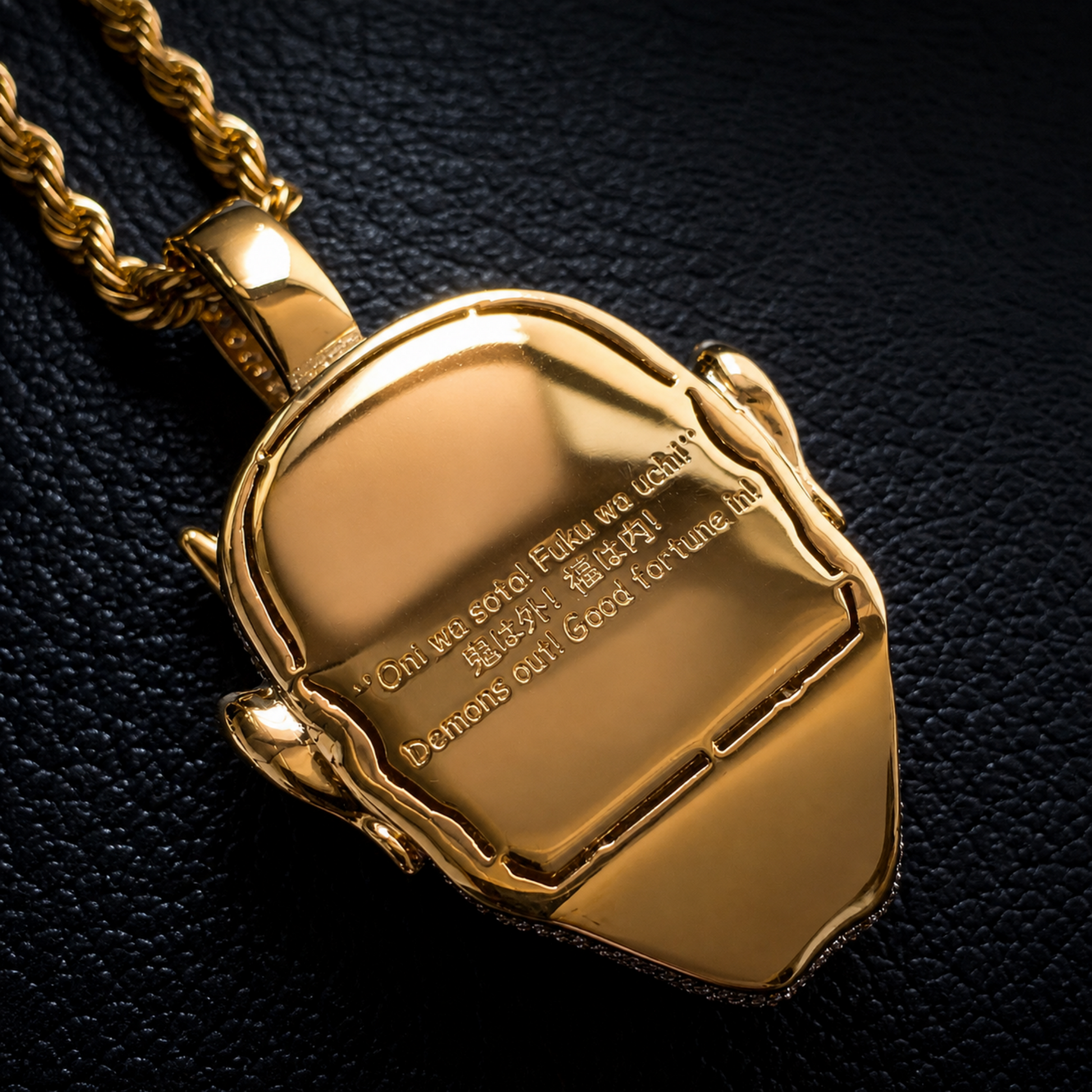 Back view of the ICEDIAMOND LET LIGHT IN Oni mask pendant with polished finish.
