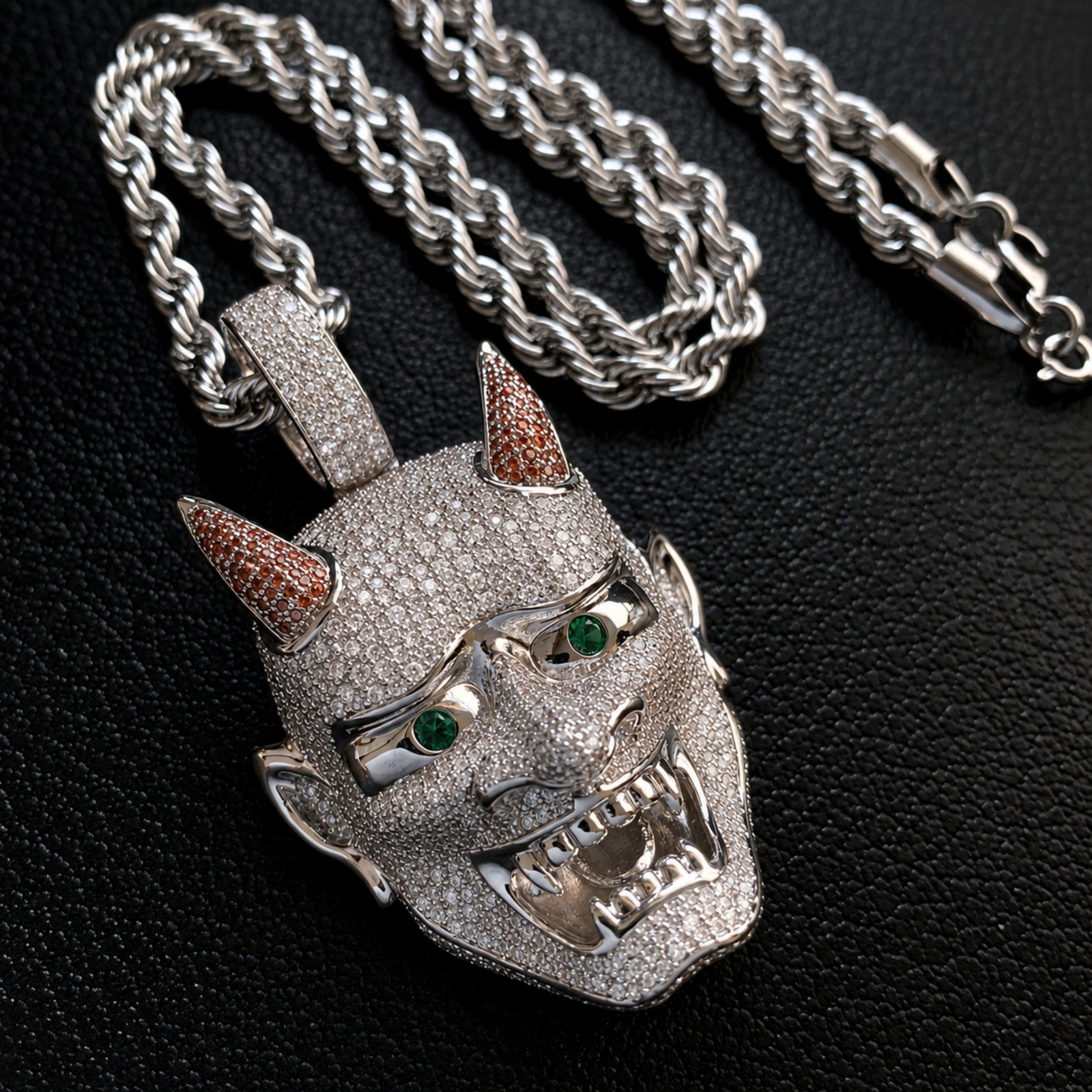 Detailed view of the ICEDIAMOND LET LIGHT IN pendant inspired by a traditional Oni mask.
