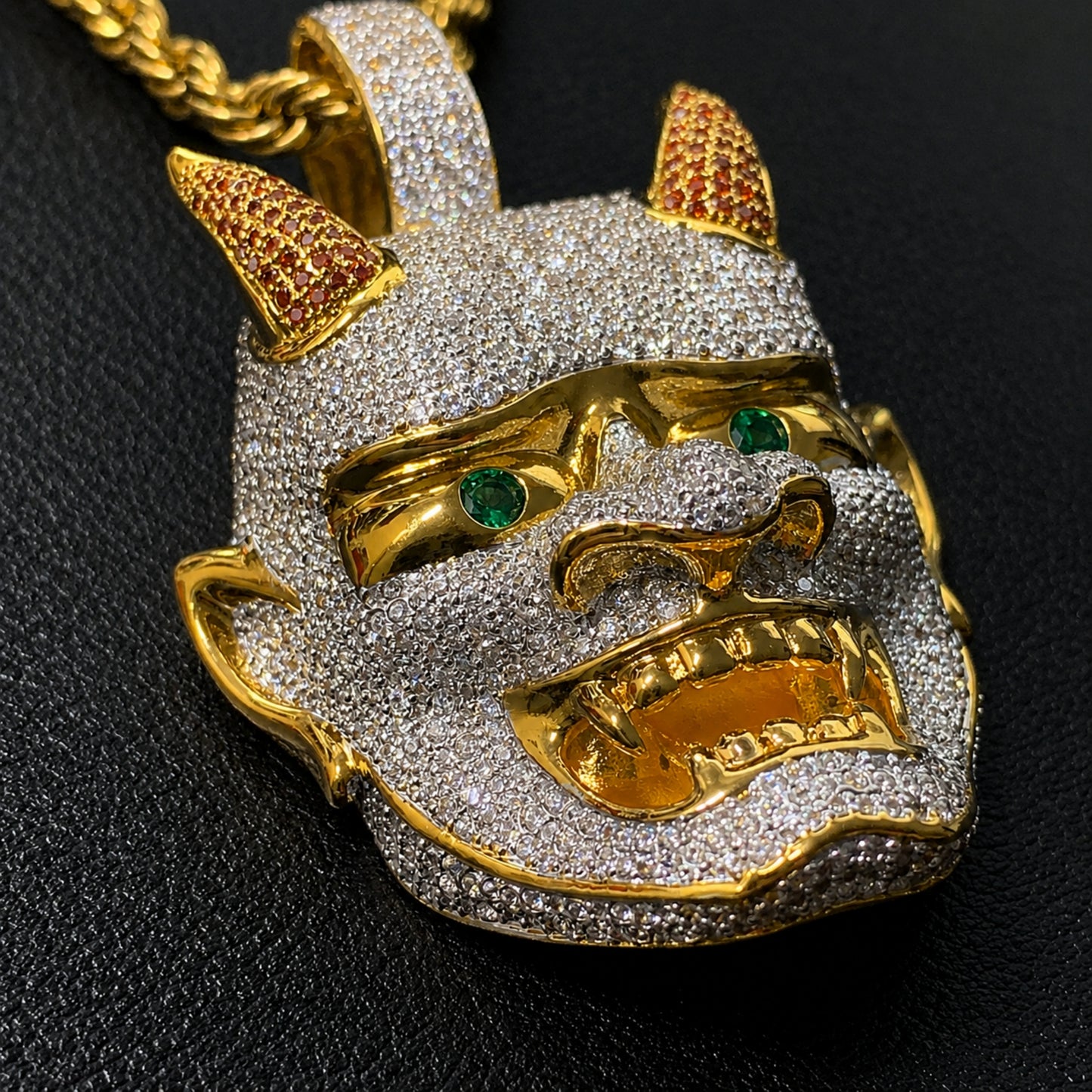 Side profile of the LET LIGHT IN Oni mask pendant highlighting its three-dimensional sculpted design.
