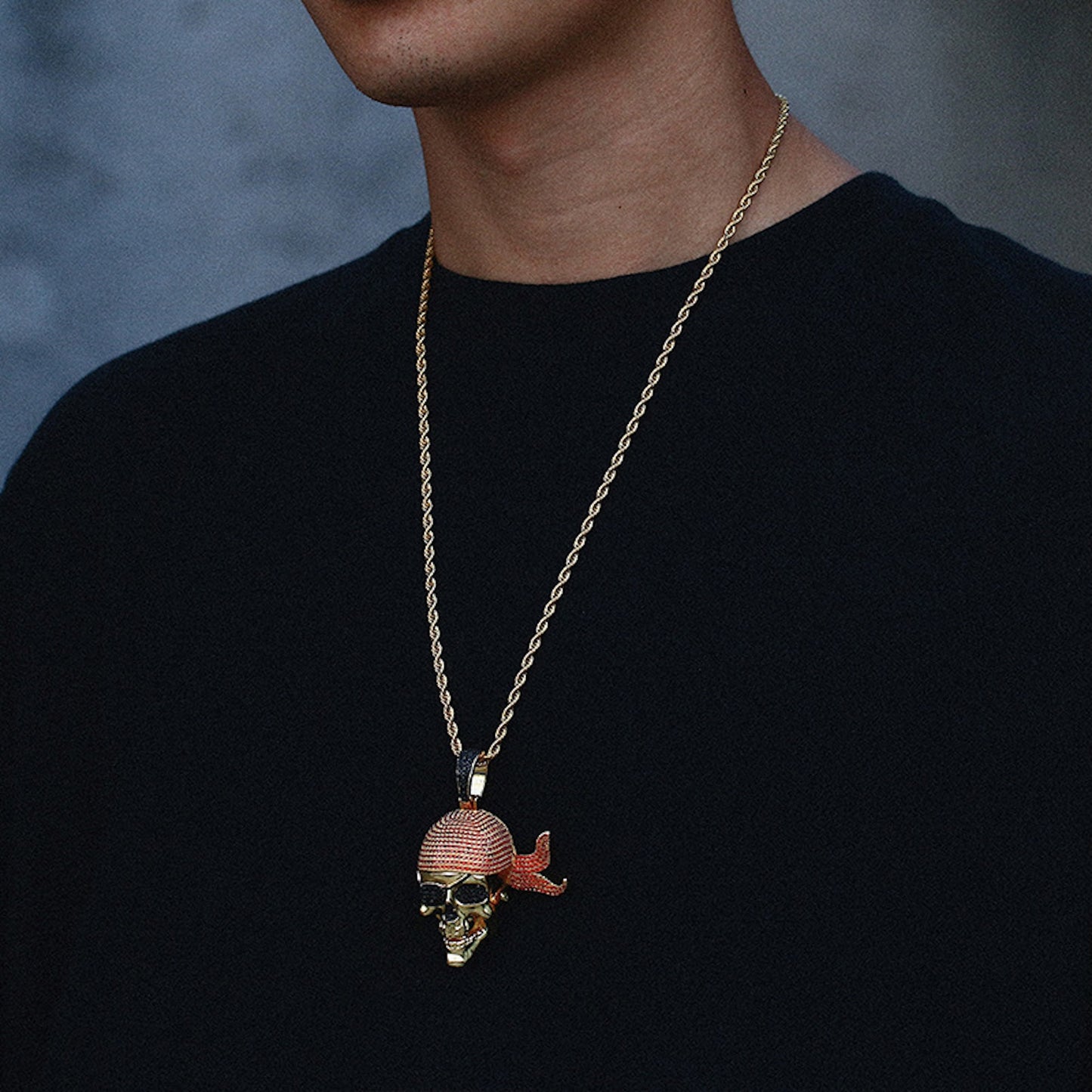 Men's pirate skull pendant necklace styled with streetwear