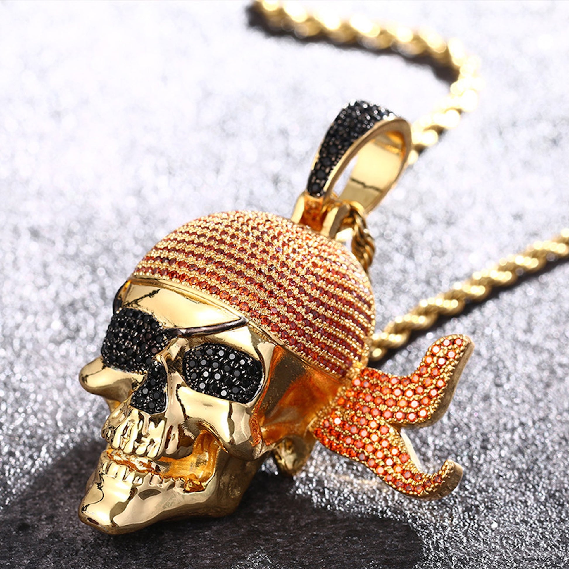 Gold plated pirate skull pendant with red bandana and iced CZ details