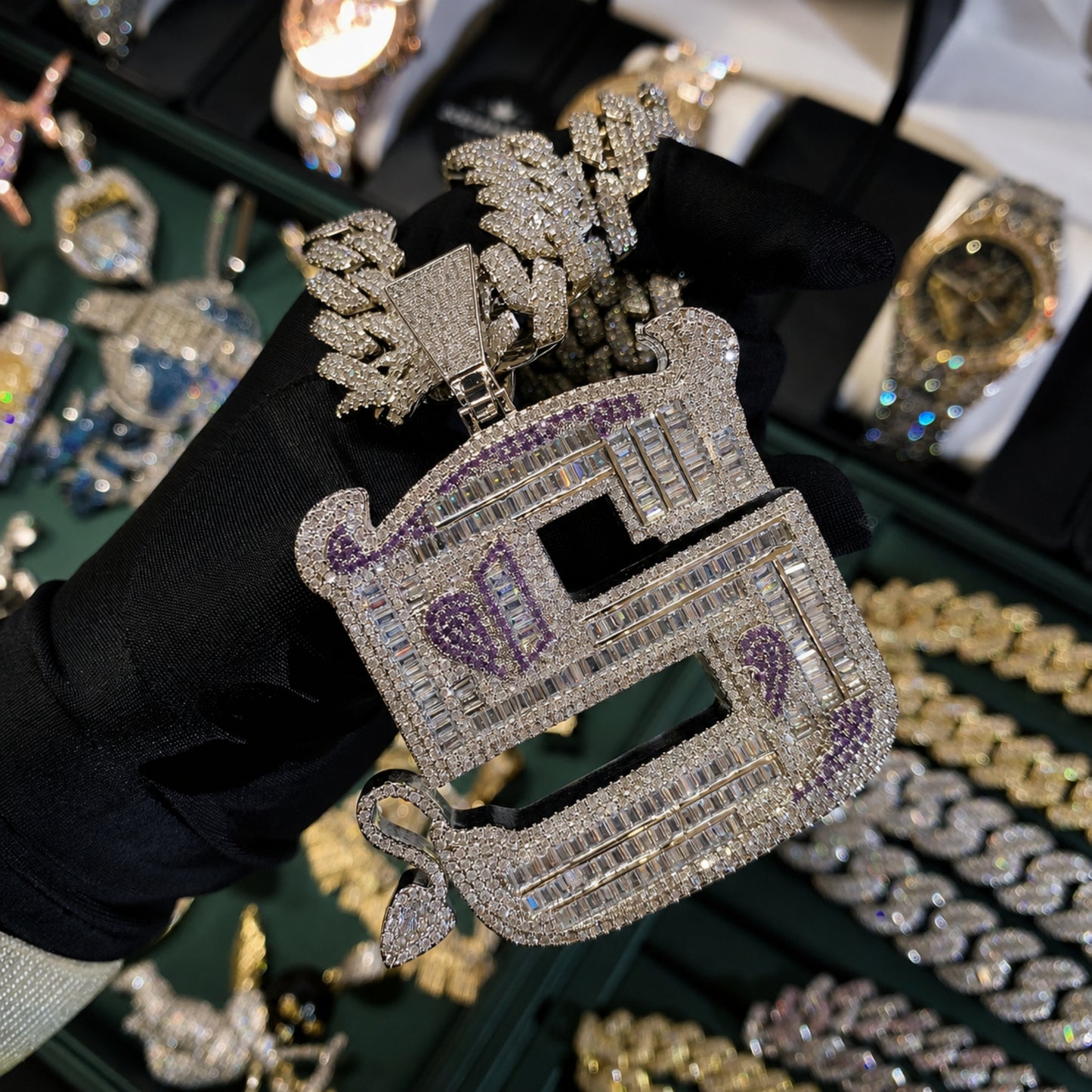 Close-up of the OWN YOUR EDGE Letter S pendant showing hand-set 5A cubic zirconia and polished craftsmanship.
