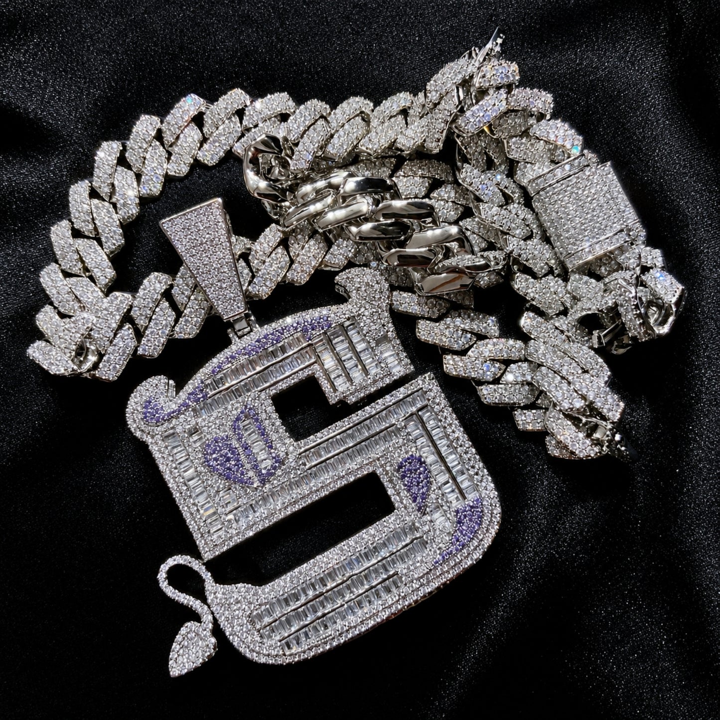 Detailed view of the ICEDIAMOND OWN YOUR EDGE pendant with distinctive horned letter S design.
