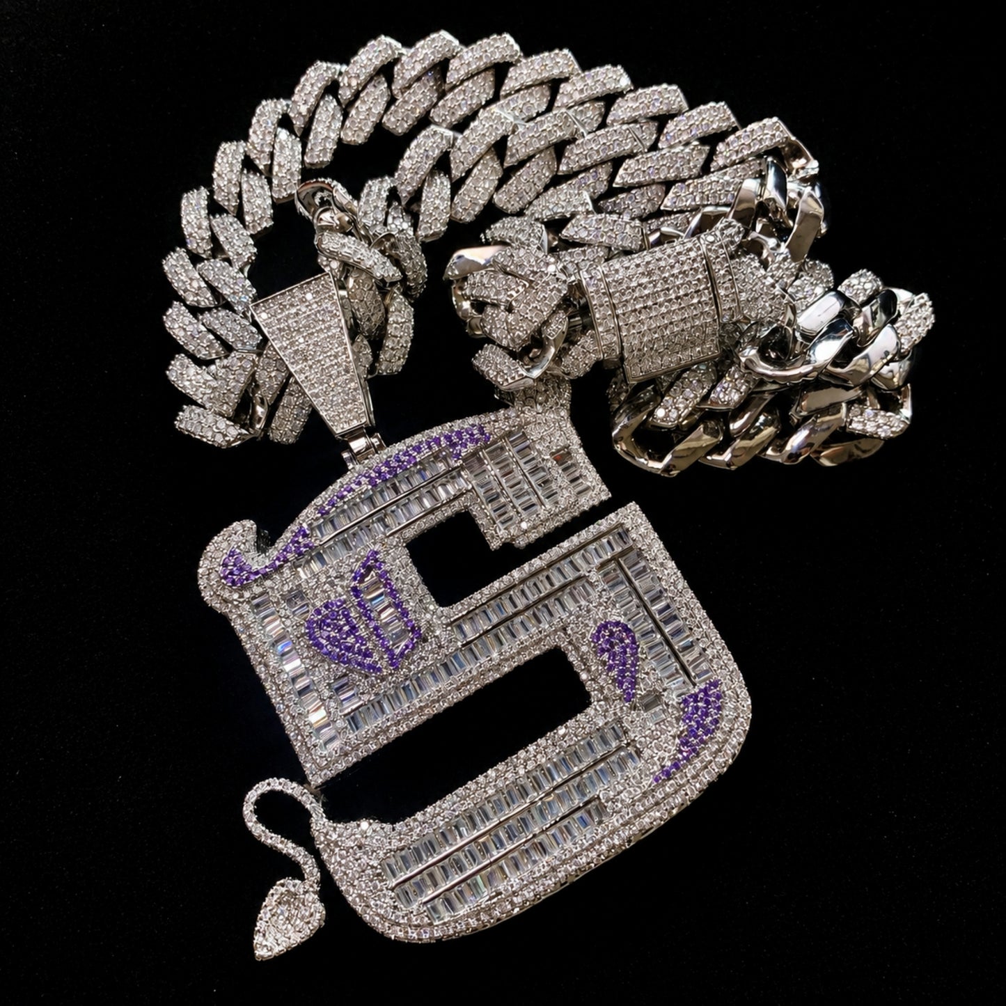 OWN YOUR EDGE Letter S pendant paired with 14 mm iced out 14k gold finished edge Cuban chain options.
