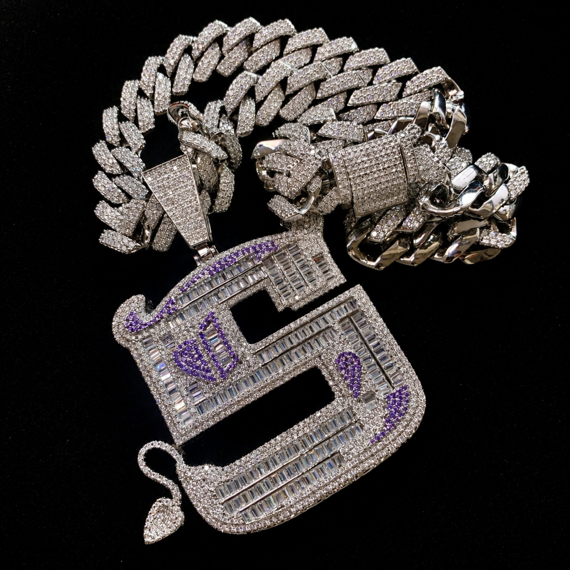 OWN YOUR EDGE Letter S pendant paired with 14 mm iced out 14k gold finished edge Cuban chain options.
