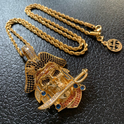 Close-up of pirate skull and curved sword pendant details