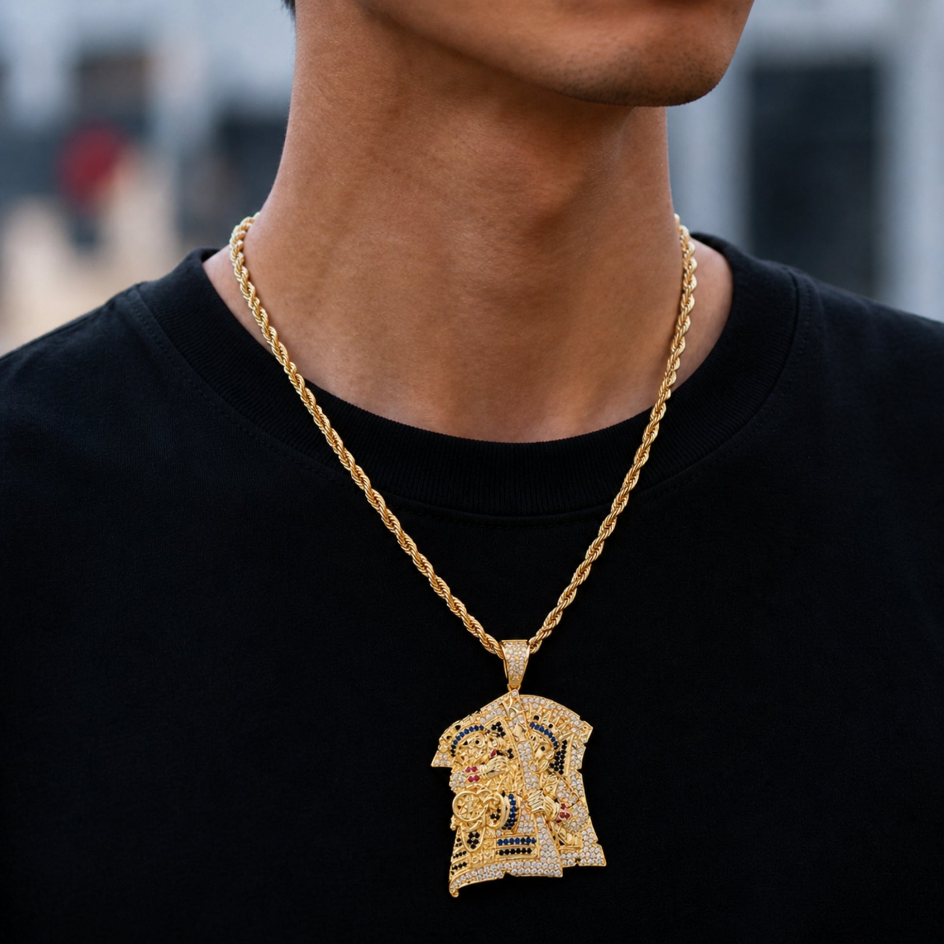 Male model wearing the ICEDIAMOND PLAY DIFFERENT playing card pendant necklace with a streetwear outfit.
