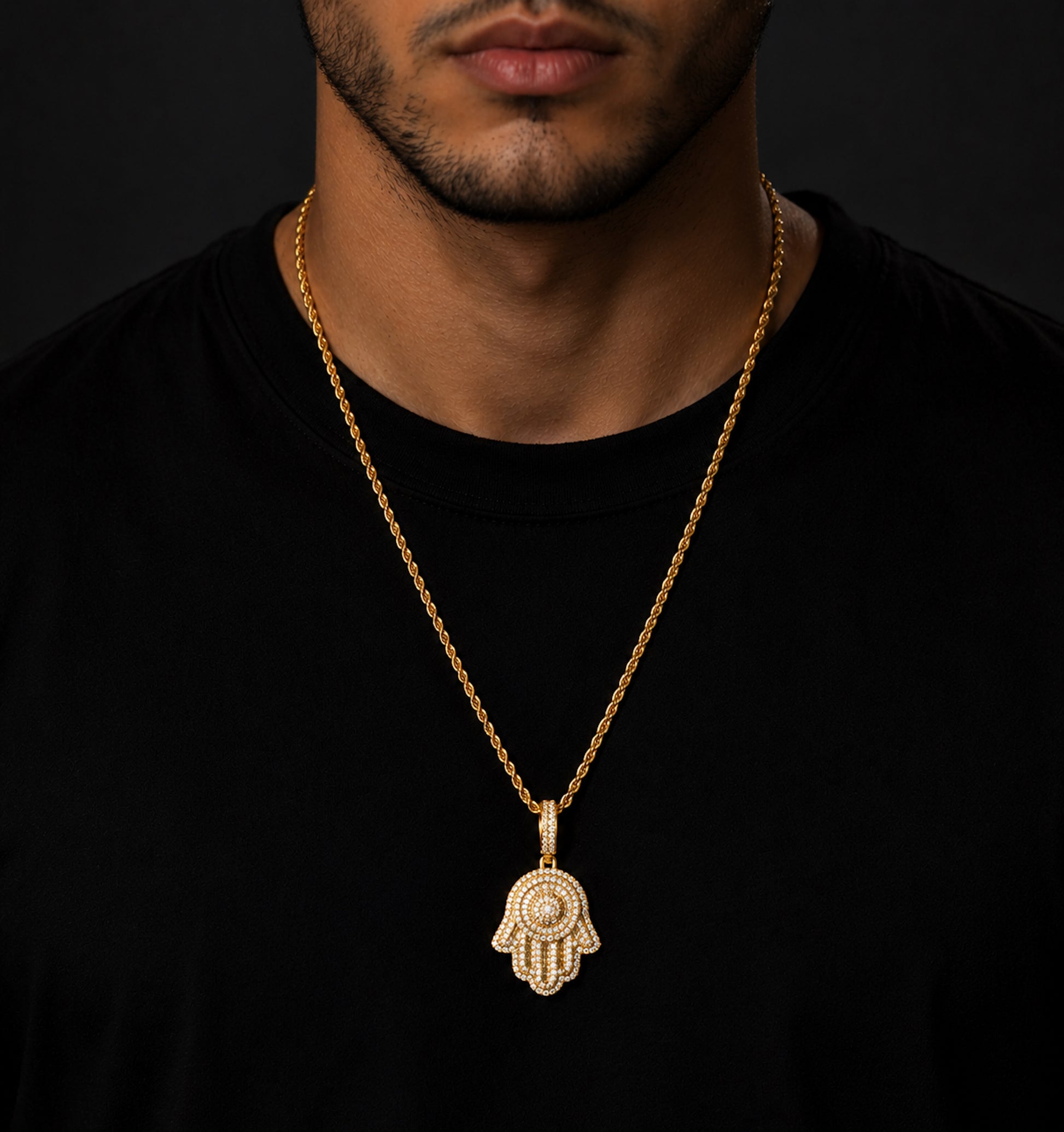 Male model wearing ICEDIAMOND SAFE HARBOR Hamsa Hand pendant necklace
