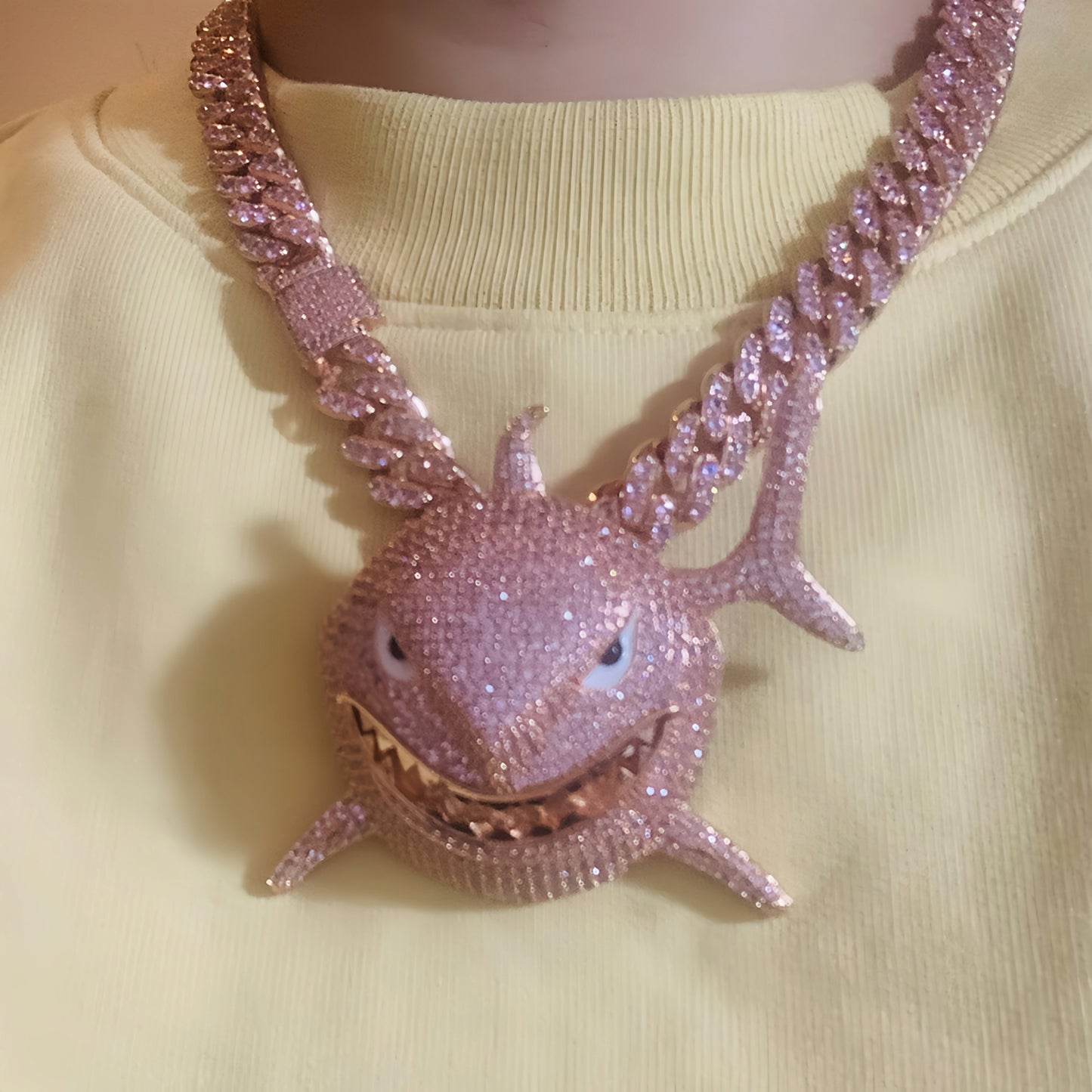 Model wearing the ICEDIAMOND SMILE BACK pink shark pendant necklace
