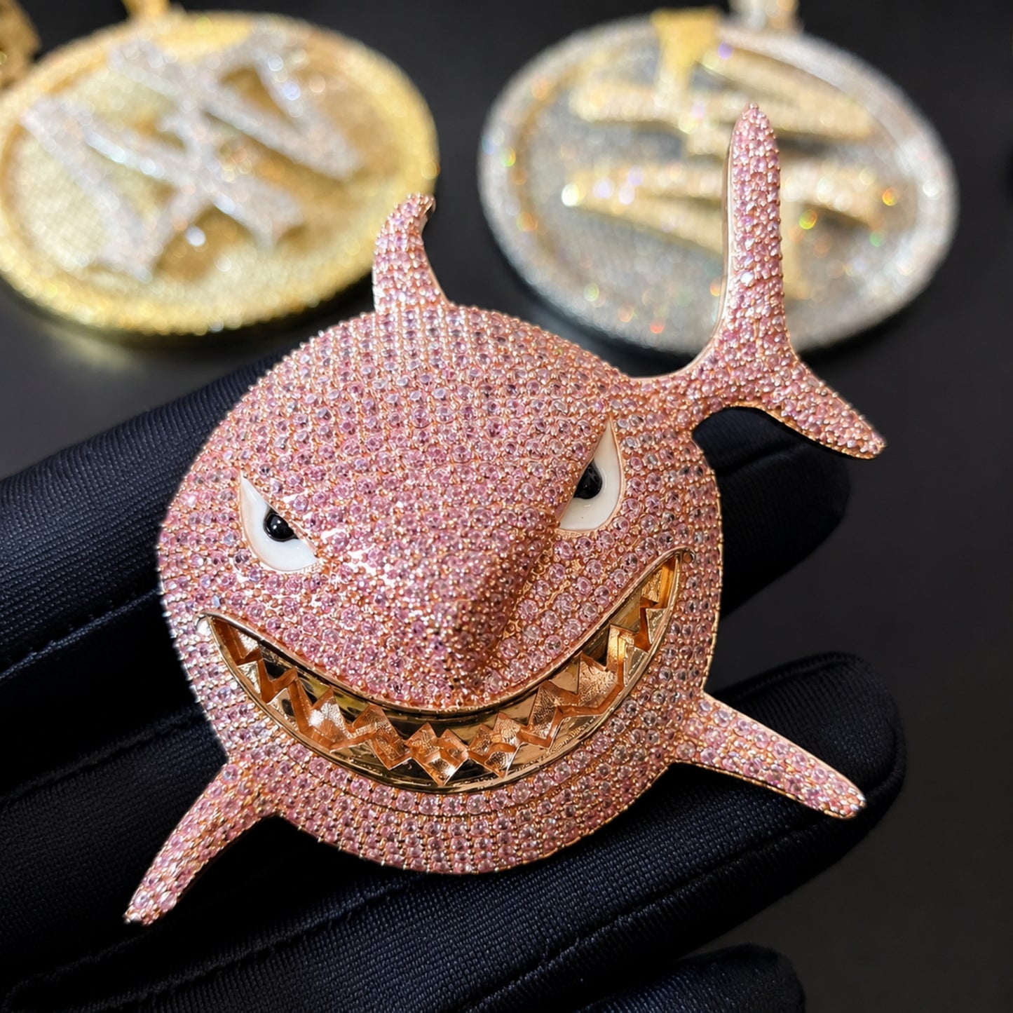 Hand-set pink cubic zirconia on the SMILE BACK shark pendant
