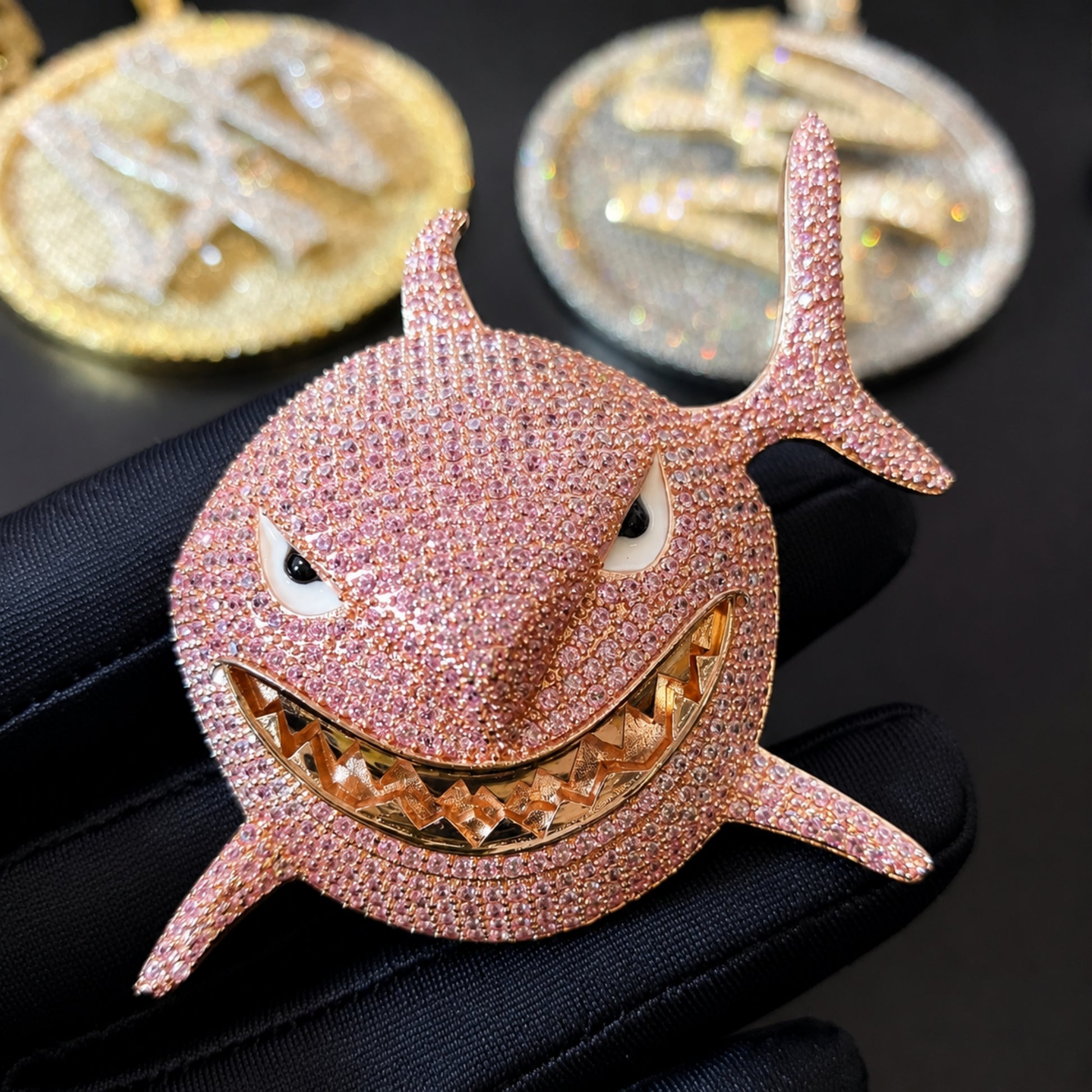 Hand-set pink cubic zirconia on the SMILE BACK shark pendant
