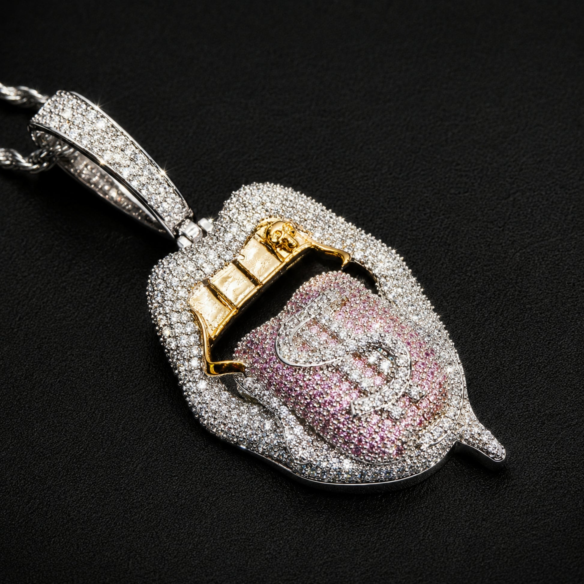 Dollar tongue pendant featuring pinkish purple cubic zirconia
