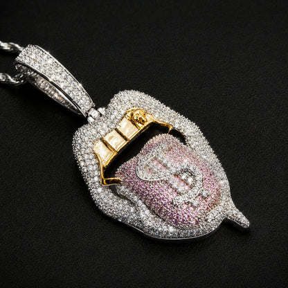 Dollar tongue pendant featuring pinkish purple cubic zirconia
