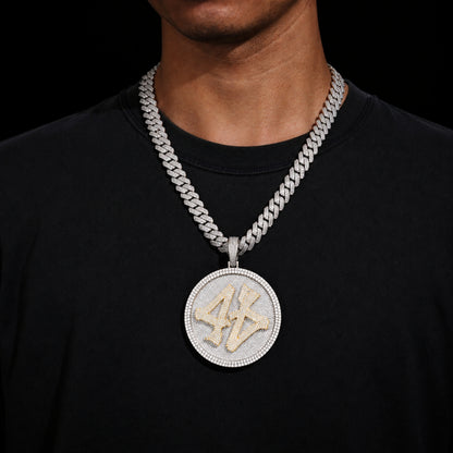 Model wearing the ICEDIAMOND TURN THE GAME oversized spinner pendant necklace with 14mm iced out cuban chain.
