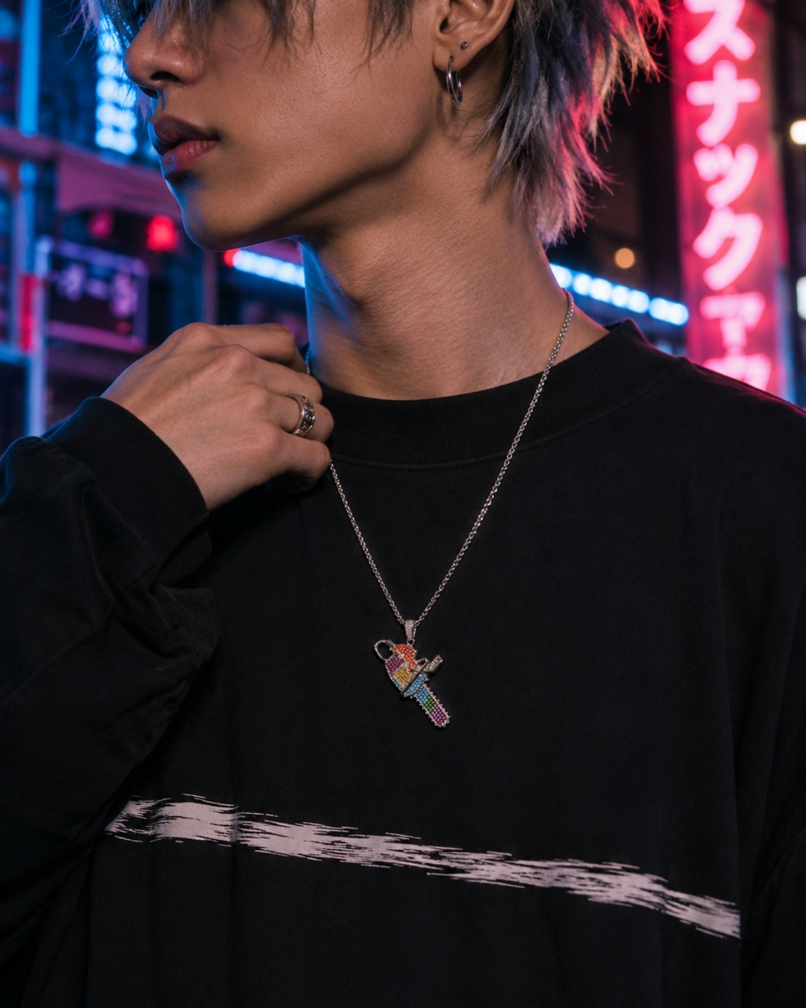 Male model wearing the ICEDIAMOND white gold plated brass iced out chainsaw pendant necklace
