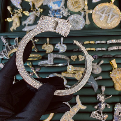 Adjustable locking mechanism of the ICEDIAMOND LIVE UNBOUND iced out cuff bracelet.
